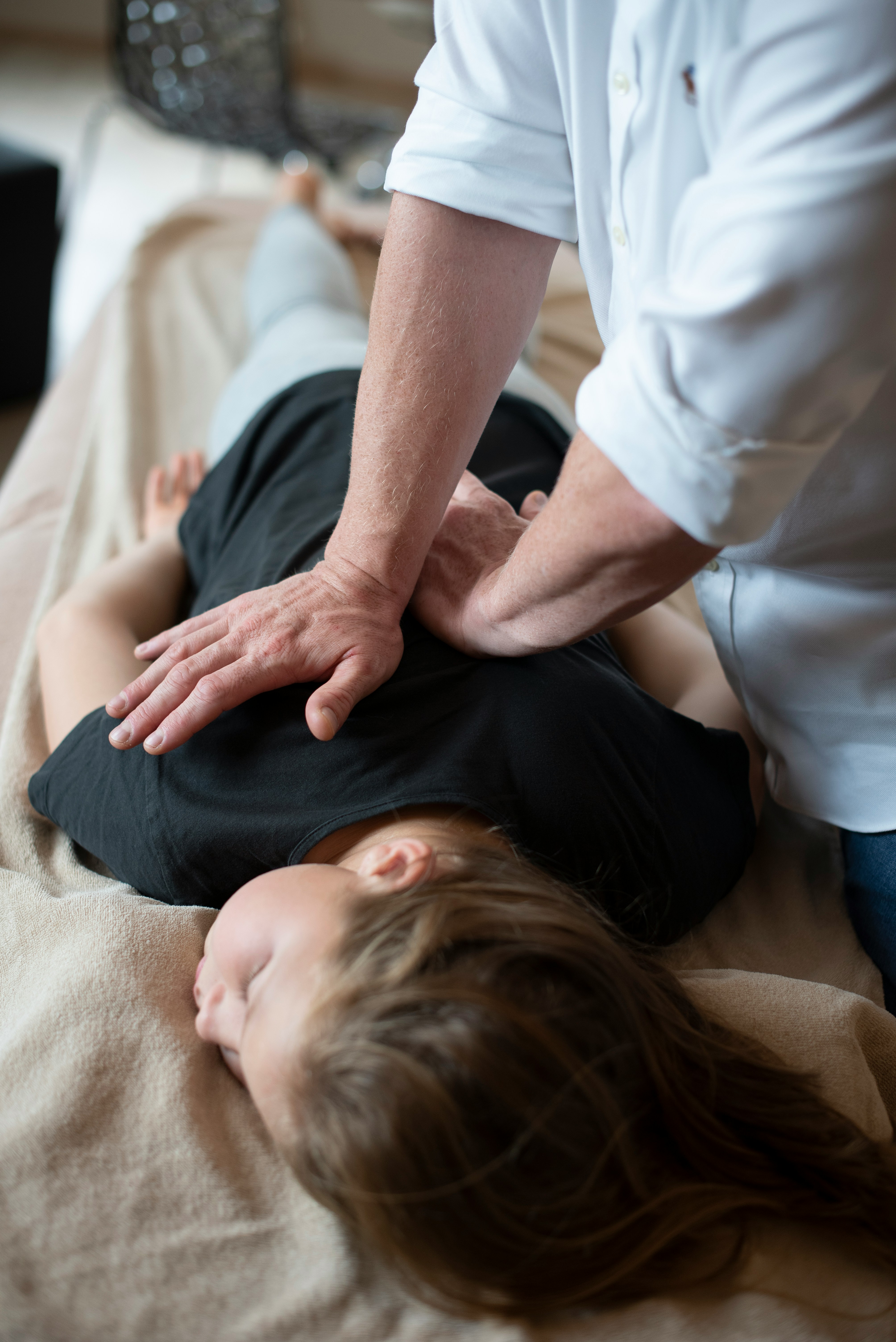 Doctor physiotherapist helping patient